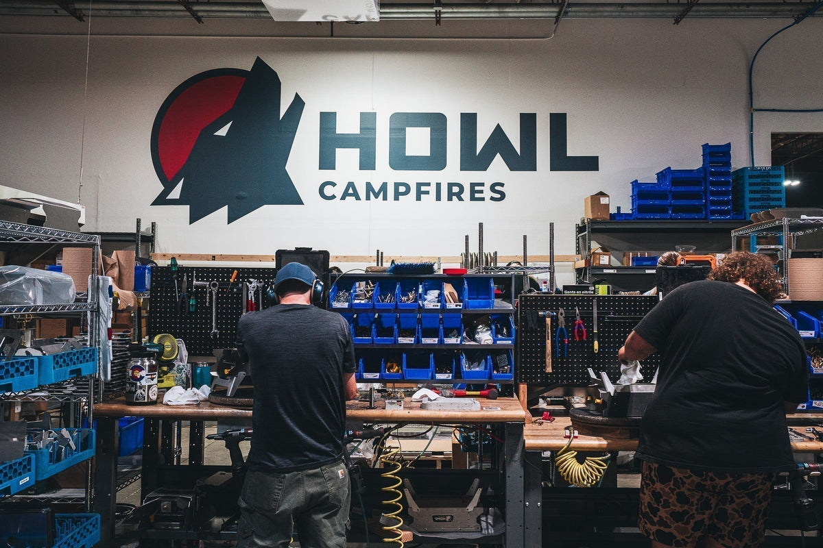 Two employees assembling HOWL propane campfires in the Colorado manufacturing plant