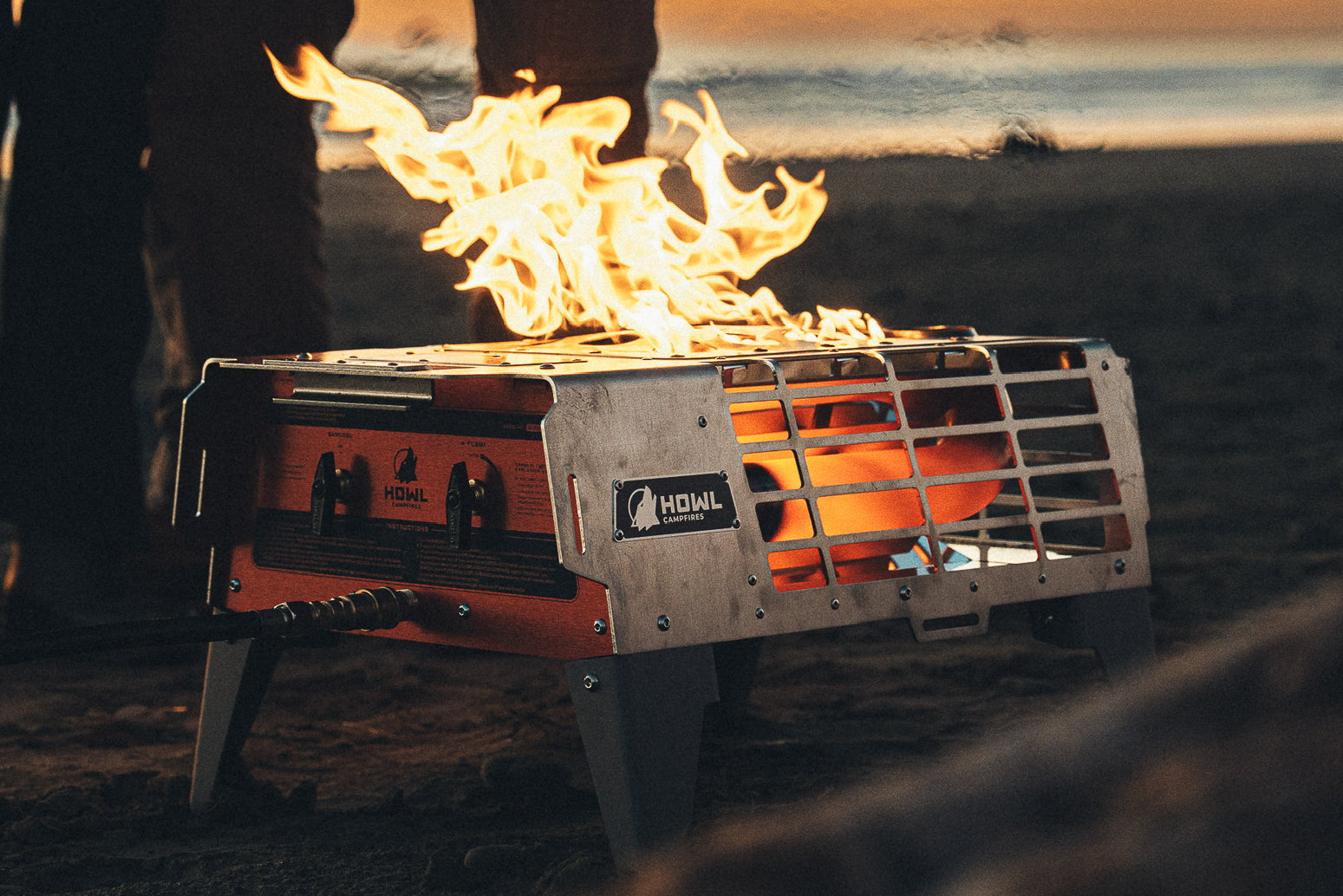 HOWL propane campfire using BarCoal radiant heat on a beach at sunset